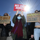 Women hold signs, demonstrating against violence, following the charge of a British police officer in the London kidnapping and murder of Sarah Everard, in Dublin, Ireland March 16, 2021. REUTERS/Clodagh Kilcoyne
